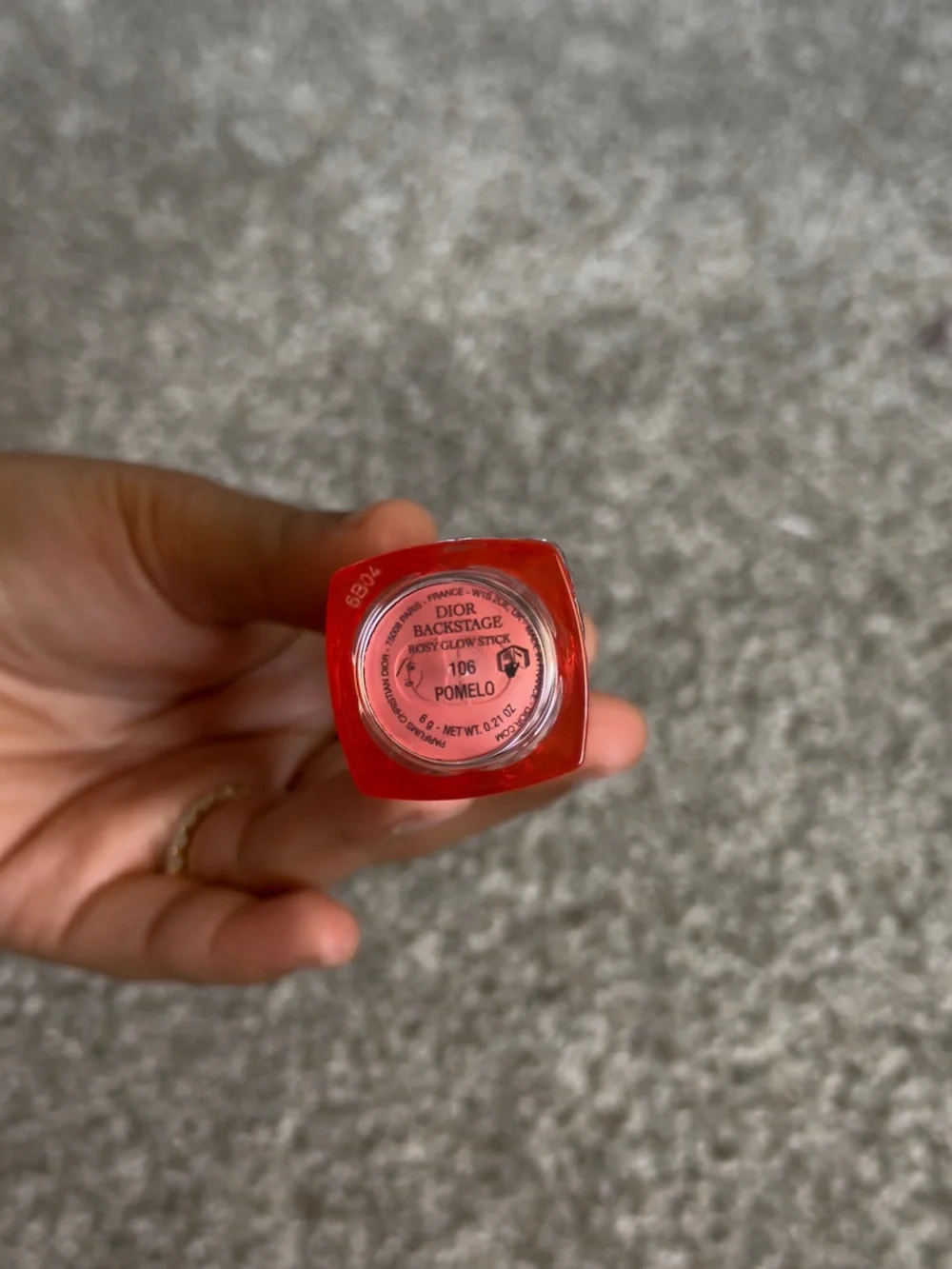 Cosmetic item on carpet